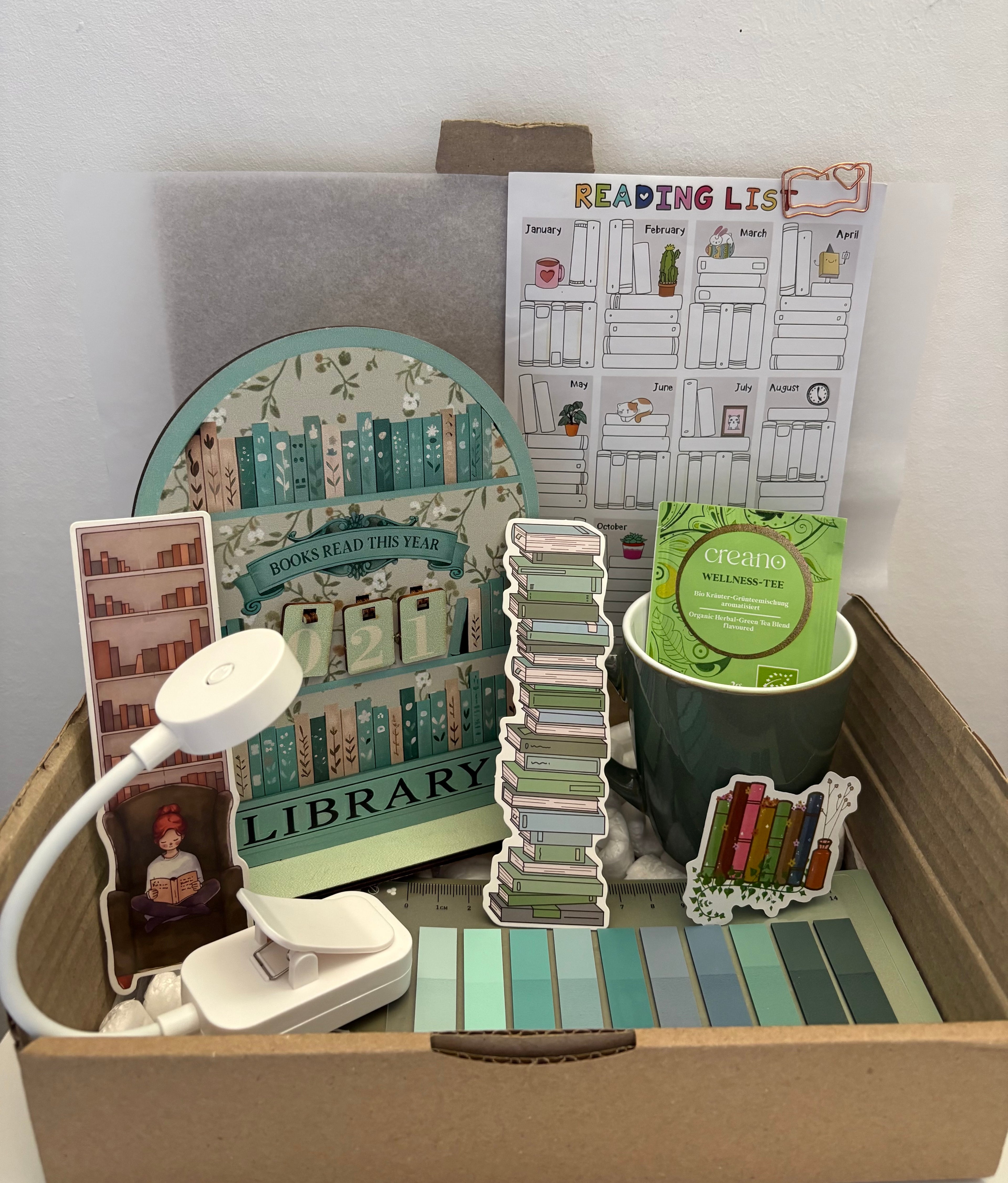 Box avec compteur de livres et goodies 💚